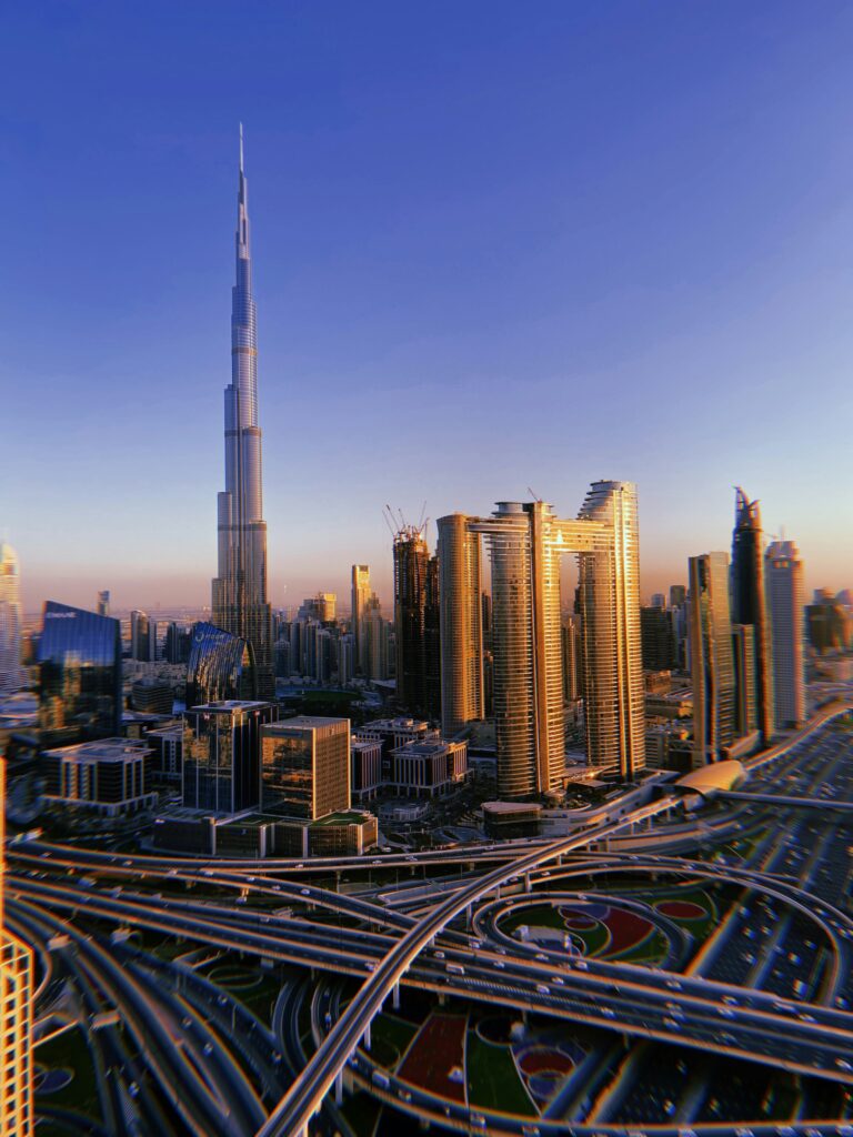 Burj Khalifa downtown Dubai skyline sunset view with city roads