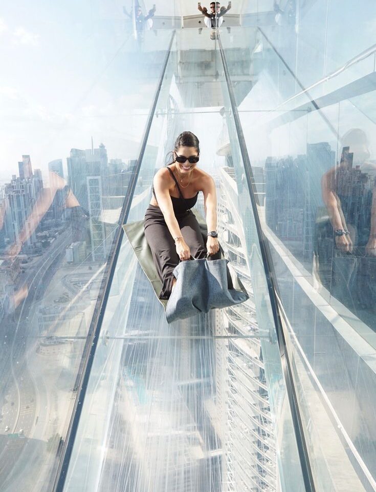 Sky Views Dubai glass slide experience with city skyline