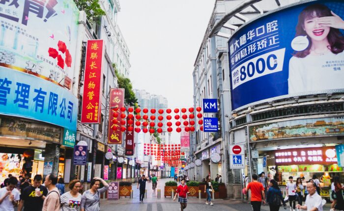 business visitors exploring street market in Guangzhou China during Canton Fair trip