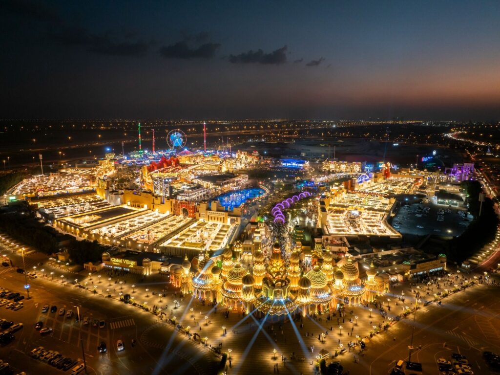 Global Village Dubai aerial night view with lights and pavilions