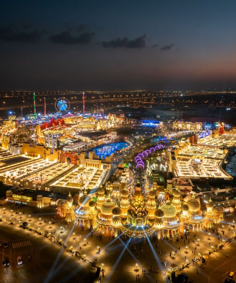 Global Village Dubai aerial night view with lights and pavilions