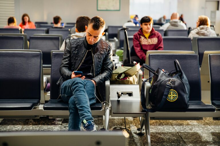 Traveler checking UAE visa extension details with passport