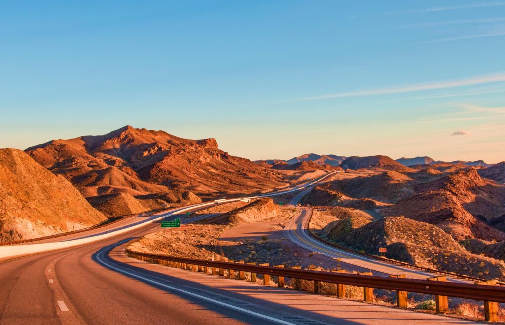 Desert road journey from UAE to Oman for visa run travel